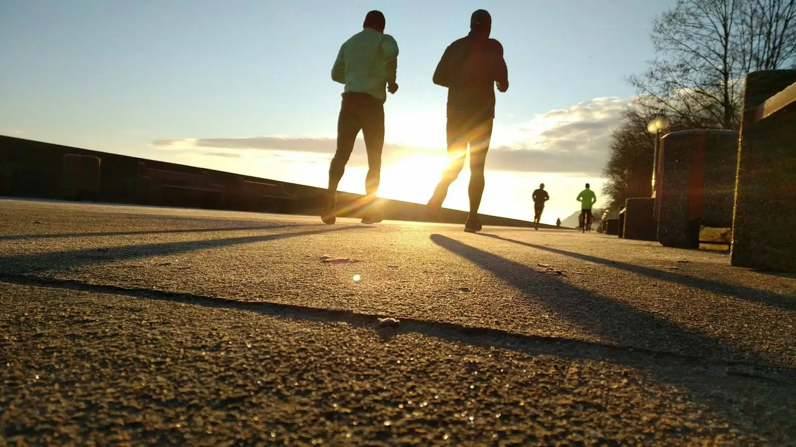 Runner silhouetted against sunset